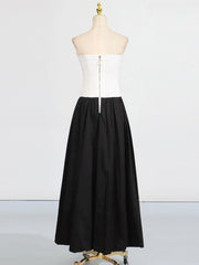 Black and white dress on a mannequin against a white background