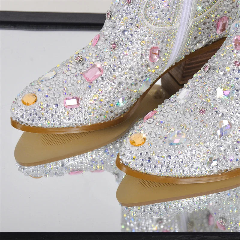 Shiny, embellished shoes with rhinestones on a white background