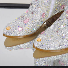 Shiny, embellished shoes with rhinestones on a white background