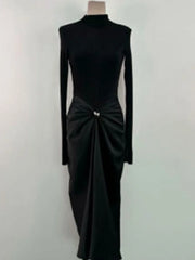 Black long-sleeve dress with a bow detail