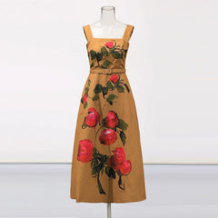Brown dress with red floral patterns on a mannequin against a white background
