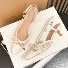 White lace slingback kitten heel pumps with bow accent