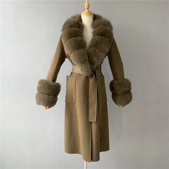 Brown coat with fur collar and cuffs on a mannequin against a plain background