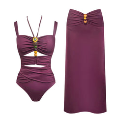 Ruched swimsuit with beaded embellishments and a matching floor-length skirt.