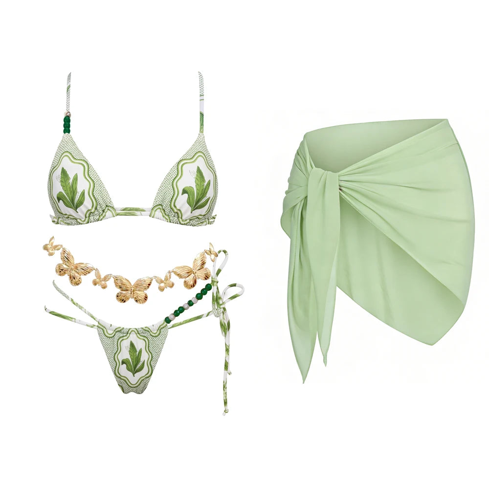 Green print triangle bikini with beaded embellishments and a matching wrap skirt.