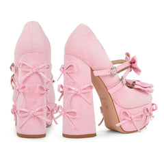 Back view of pink platform Mary Jane heels showcasing multiple bow details on the block heel.