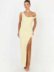 Model wearing a pale yellow one shoulder maxi dress