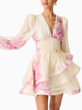 Floral print v-neck mini dress with long sleeves and layered ruffle skirt.