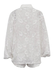White lace blouse on a white background