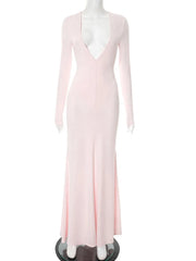 Pink evening gown on a mannequin against a white background