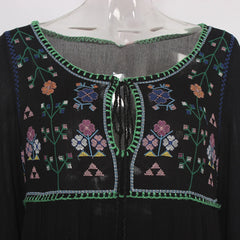 Black embroidered garment on a mannequin