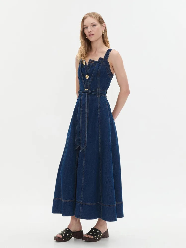 Side view of a denim midi dress with button front