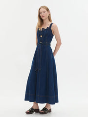 Side view of a denim midi dress with button front