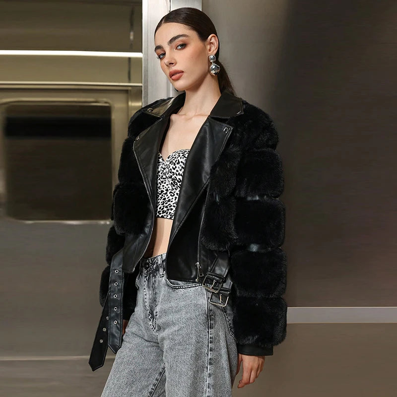 Woman wearing a black fur coat and leopard print top in an indoor setting