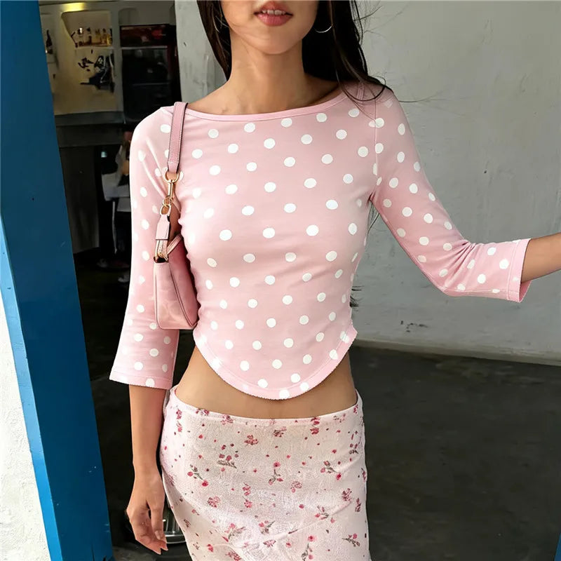 Pink polka dot boat neck 3/4 sleeve crop top with curved hem