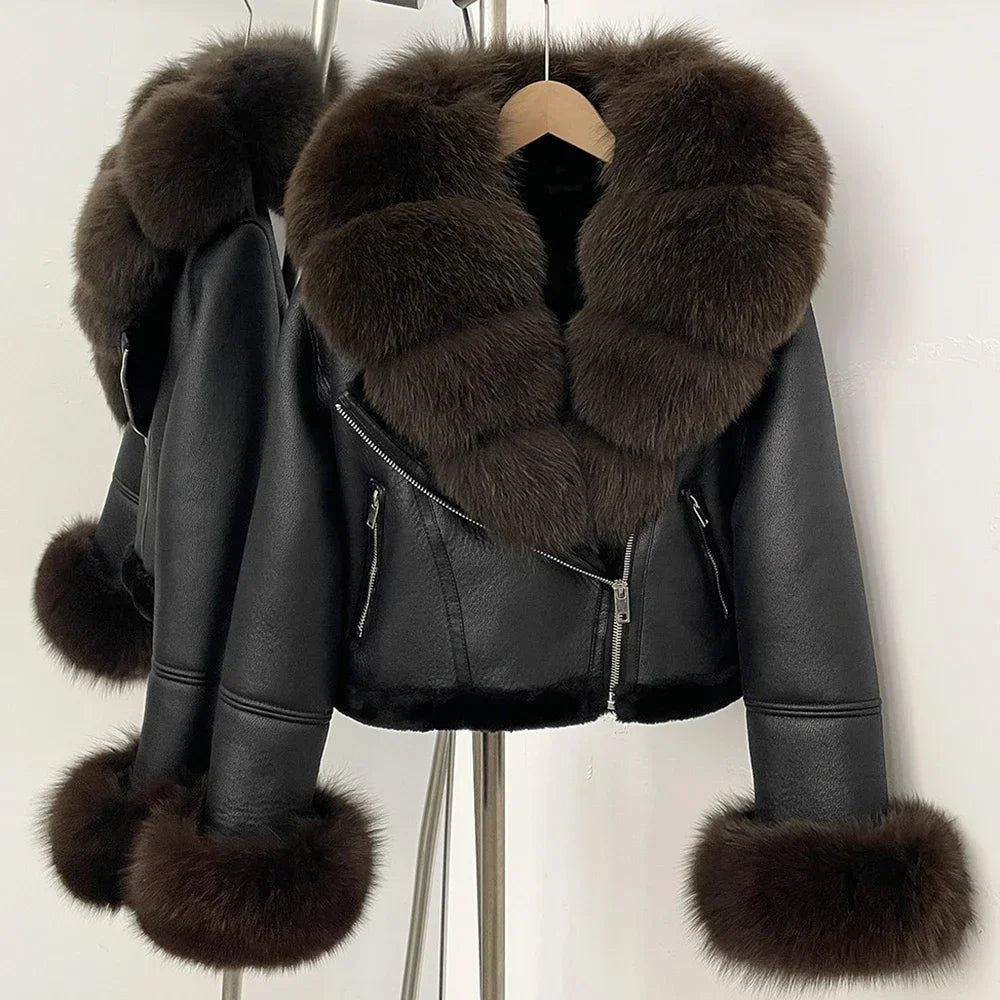 Black leather jacket with fur trim on a hanger against a white background