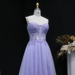 Lavender evening gown on a mannequin with a dark background
