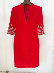 Red V-neck dress with beaded three-quarter sleeves, detail
