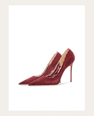 Red high-heeled shoes on a white background