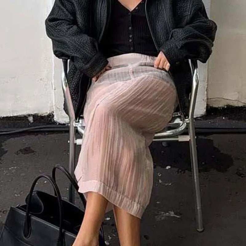Sheer pleated slit midi skirt on chair