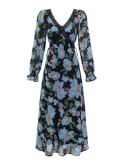 Close-up of the lace trim on the V-neck of a floral print maxi dress.