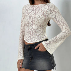 Lace long-sleeve top worn by a person on a plain background