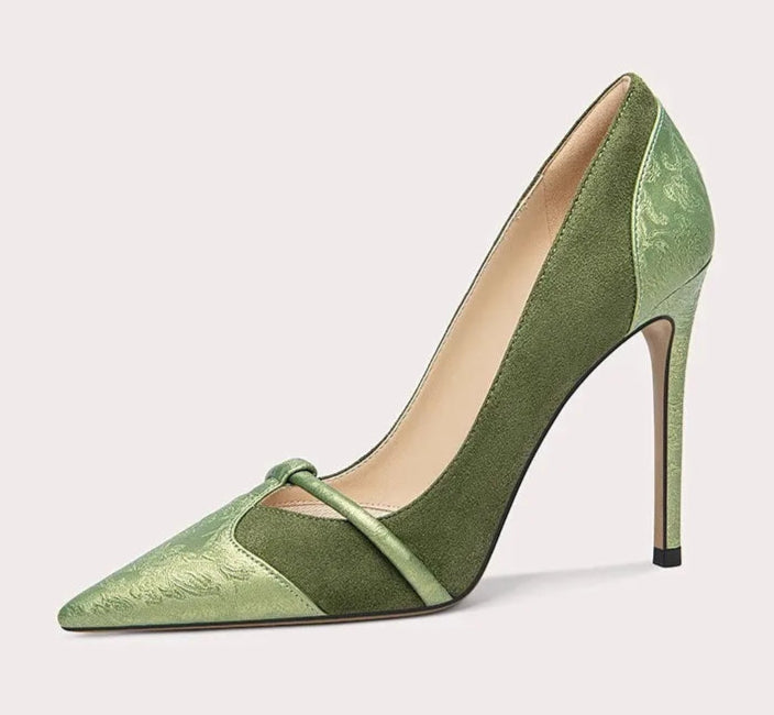 Green high-heeled shoe on a white background