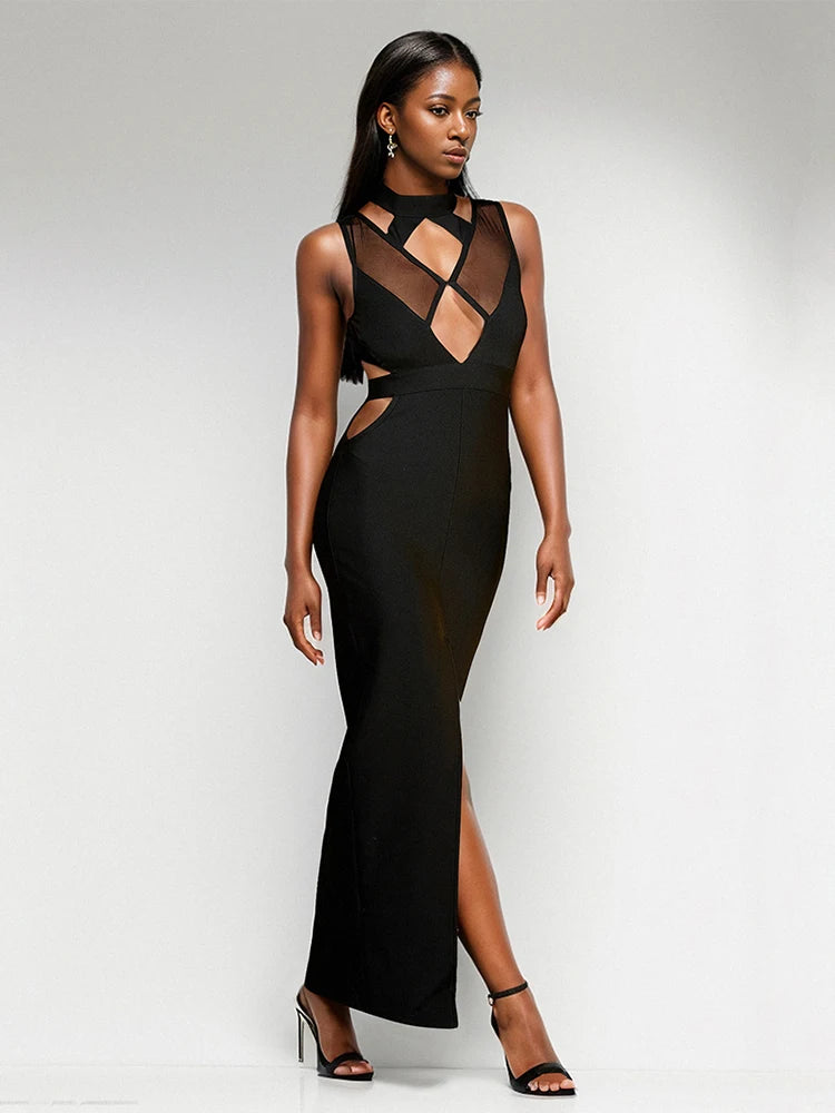 Woman wearing a black evening gown with cut-out design on a white background