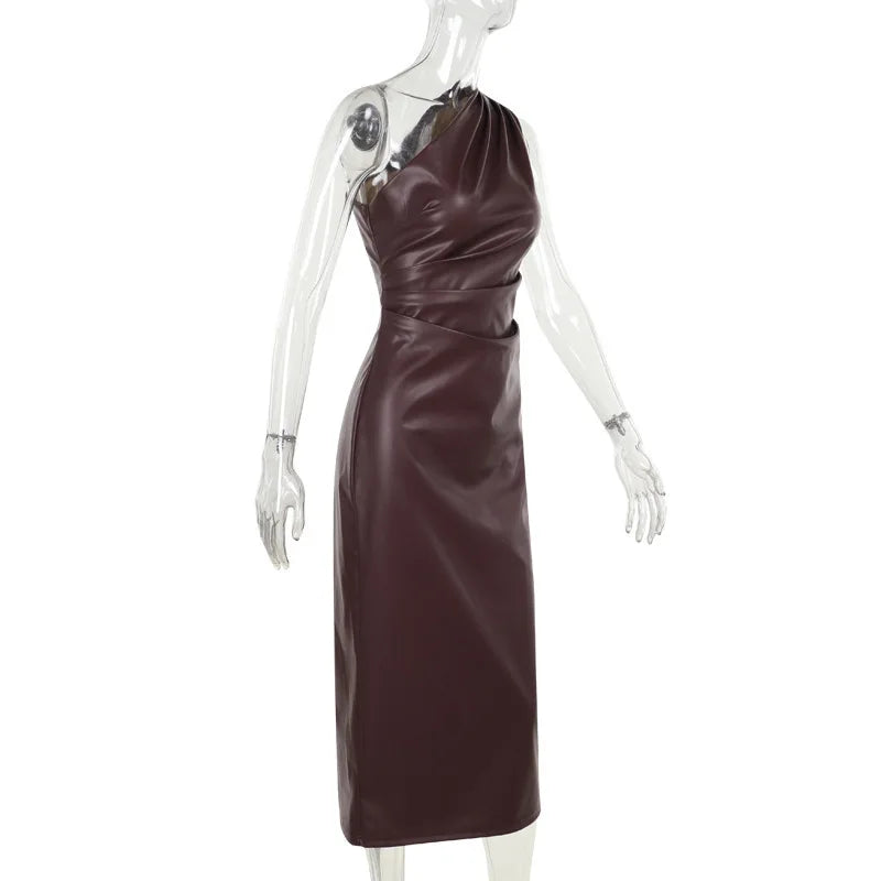 Brown halter neck dress on a mannequin against a white background