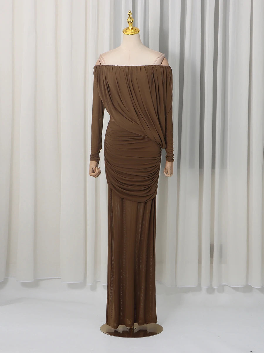 Brown off-shoulder long-sleeve gown on a mannequin against a white curtain background