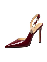 Red high-heeled shoe with a gold buckle on a white background