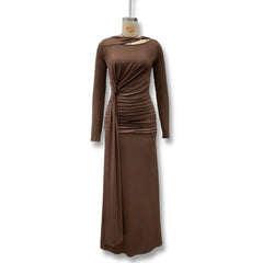 Brown dress on a mannequin against a white background