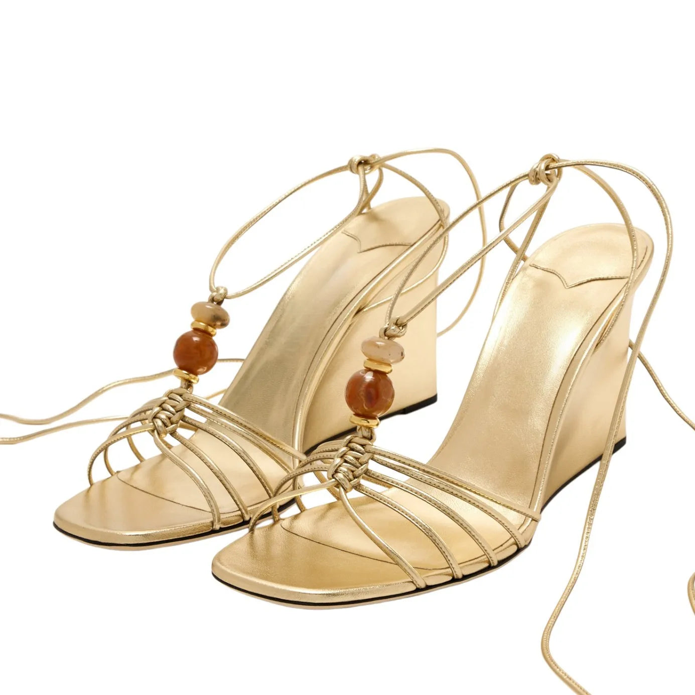 Gold strappy wedge sandals with natural stone beads and ankle wrap tie