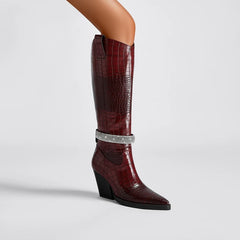 Burgundy embellished pointed toe knee-high western boots.