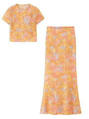 Yellow floral dress with a matching skirt on a white background