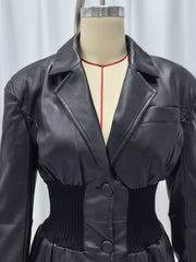 Black leather jacket on a mannequin against a plain background