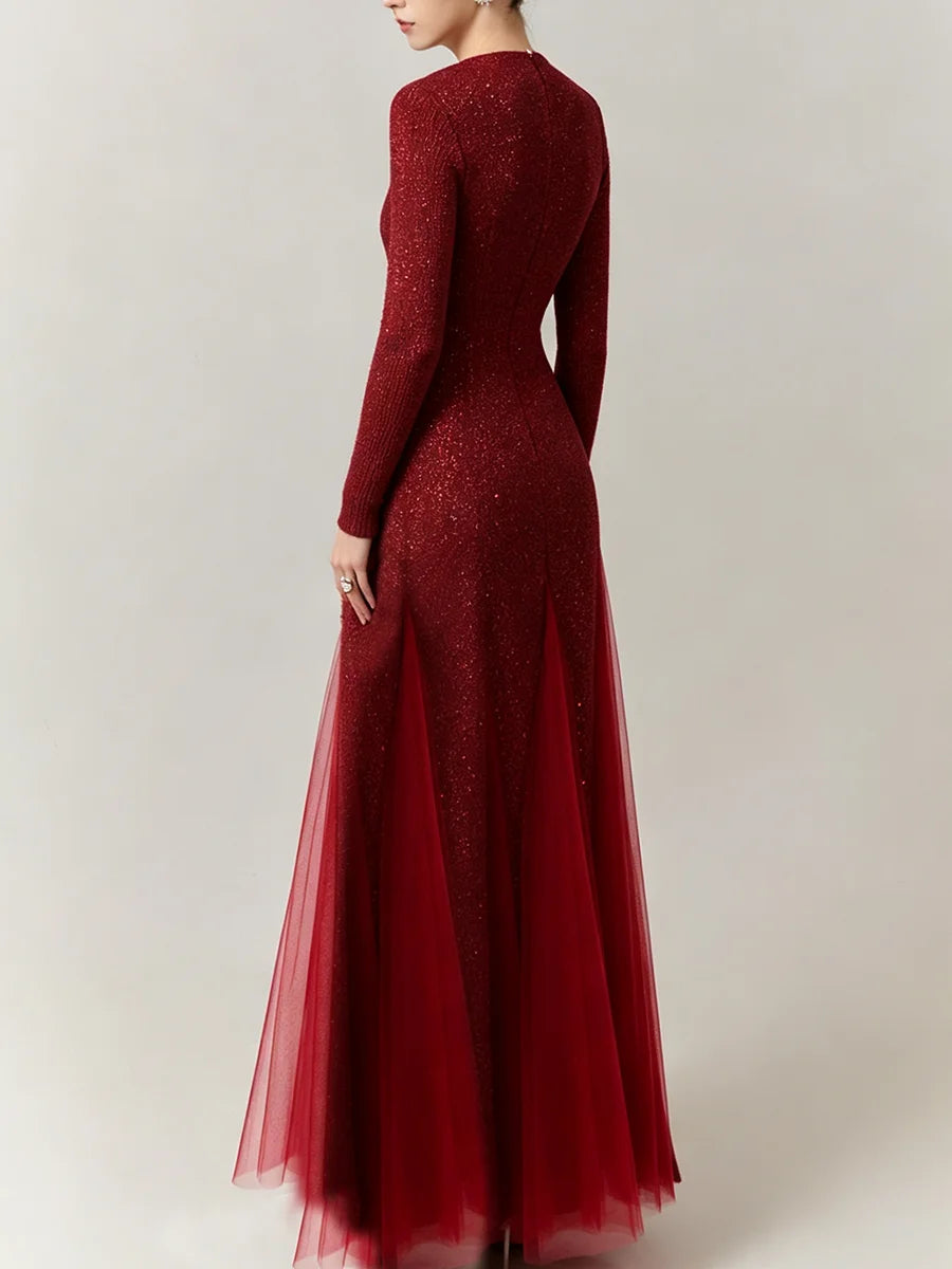 Back view of a red sequin maxi dress with floral details