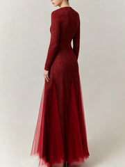 Back view of a red sequin maxi dress with floral details