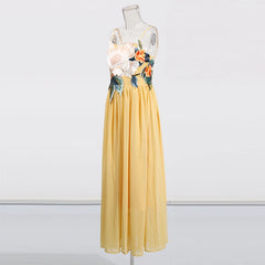 Yellow dress with floral top on a mannequin against a white background