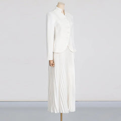 White dress on a mannequin against a plain background