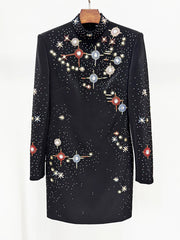 Black dress with celestial pattern on a white background