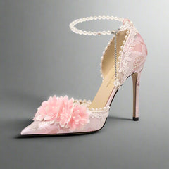 Pink high-heeled shoe with floral design and pearl details on a white background