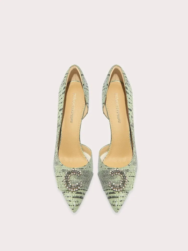 Pair of green pointed-toe high heels on a light gray background