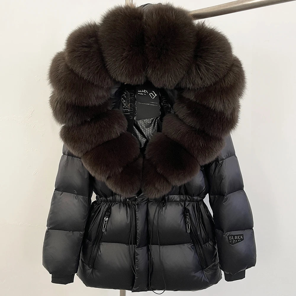 Black puffer jacket with large fur collar on a white background