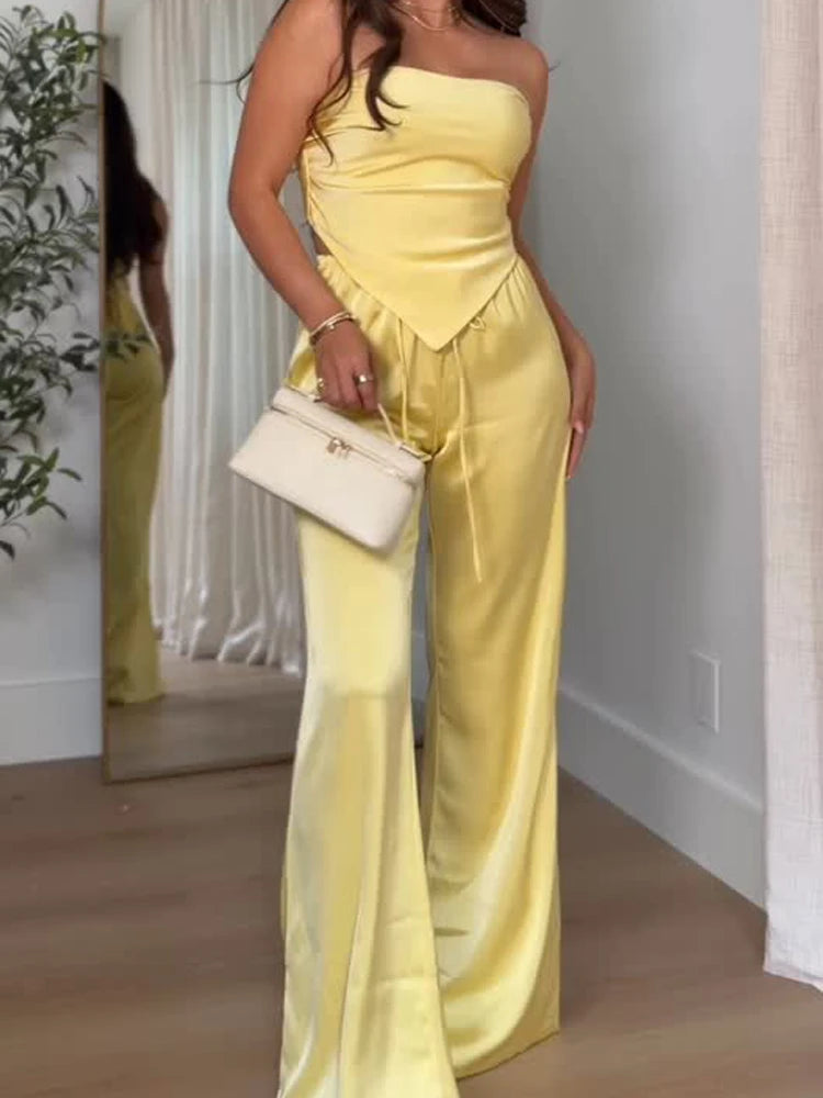 Close-up of yellow satin tube top and wide leg pants set