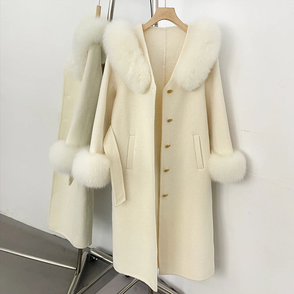 Close-up of cream wool coat with fox fur collar and cuffs.