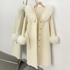Close-up of cream wool coat with fox fur collar and cuffs.