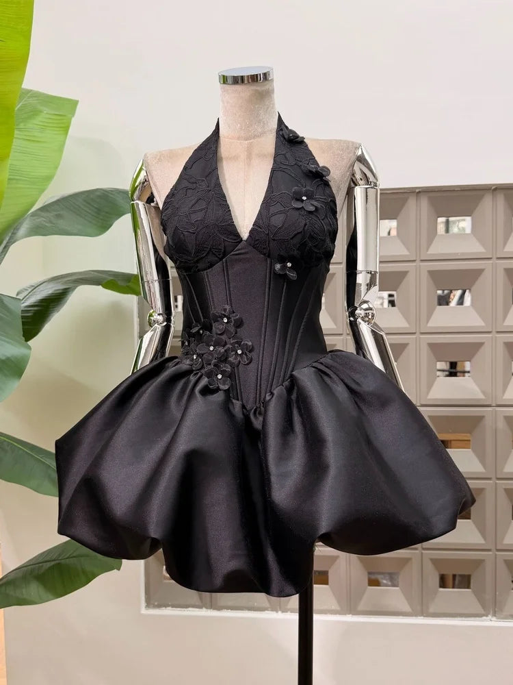 Black appliqued floral halter mini dress with corseted bodice and bubble hem