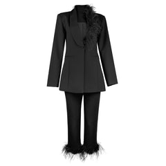 Black suit with feather details on a white background