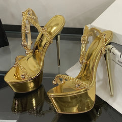 Pair of gold metallic platform stiletto heels with chain embellishments